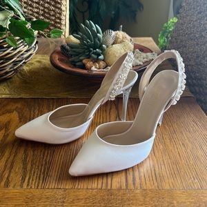 White satin pump. New with box